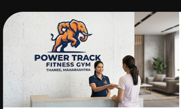 Front desk team welcoming a member at Power Track Fitness Gym
